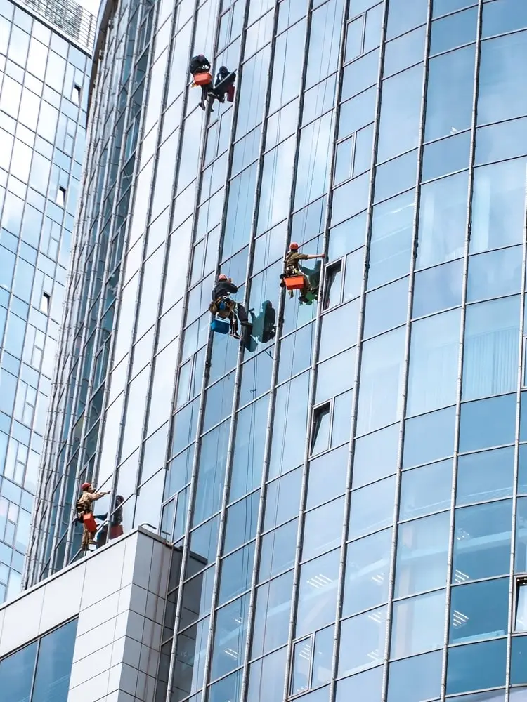 High-rise technicians cleaning office building windows
