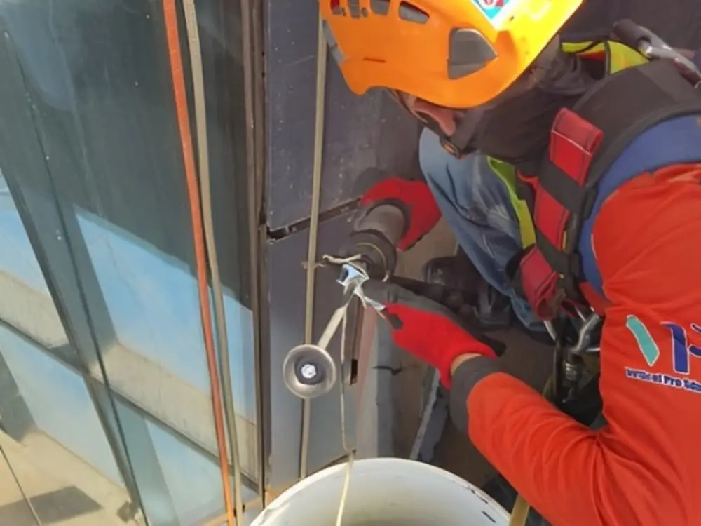 Professional technicians carrying out external facade cleaning